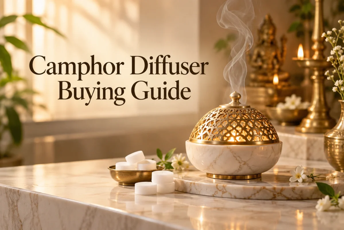 Camphor diffuser buying guide: brass-domed marble camphor diffuser releasing smoke beside camphor tablets on a marble altar